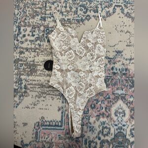 Lulus white lace body suit (never worn)